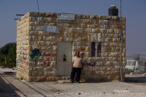 Amjad outside the village school 