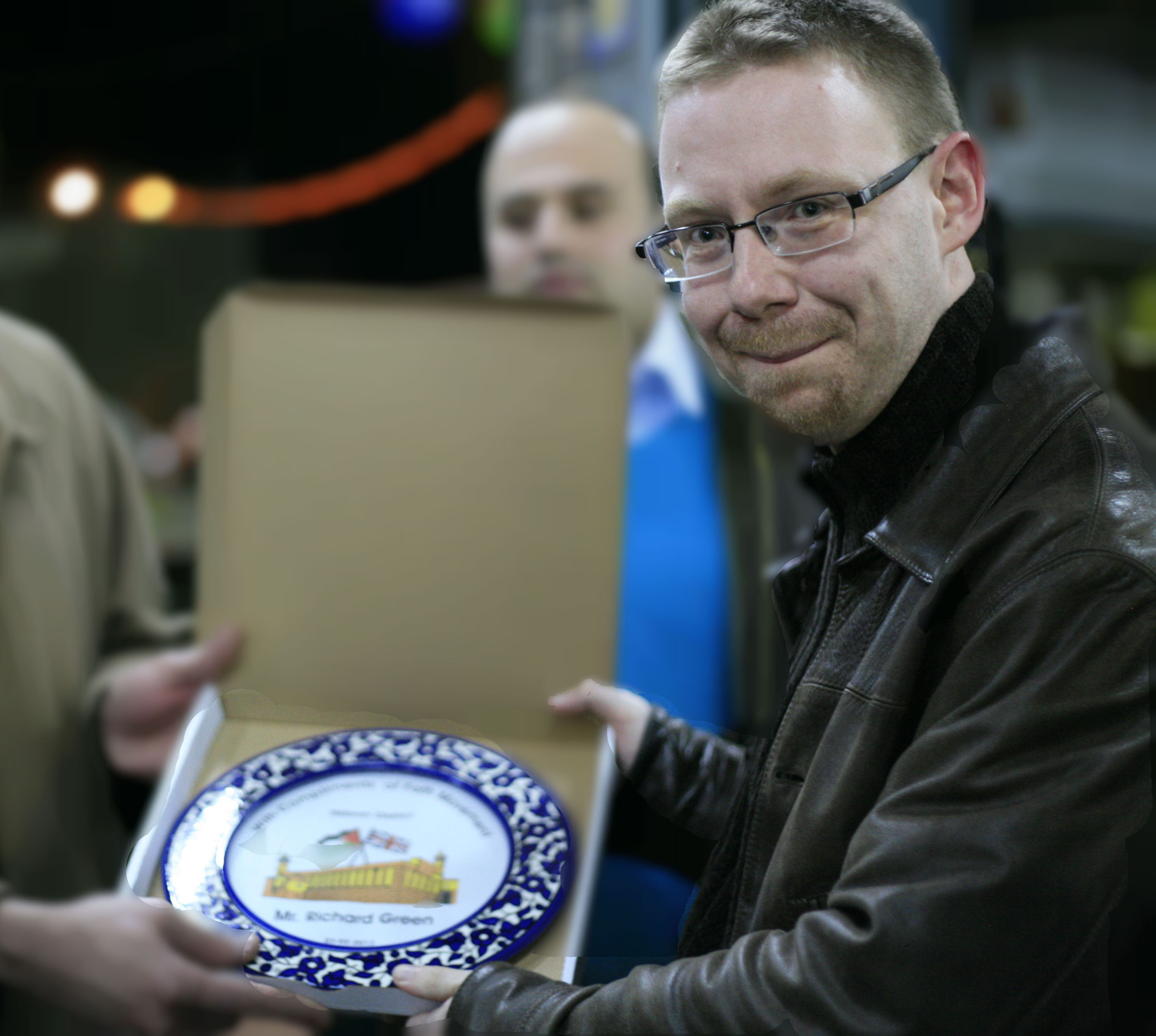 Richard Green receiving a plate in Palestine